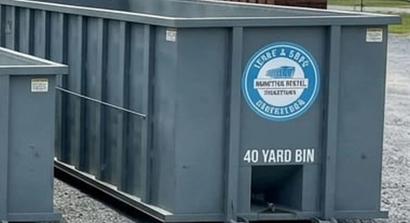 A clean, correctly-labeled 40 yard Issac & Sons Dumpster Rental roll-off container staged at the company yard on Burhans Blvd